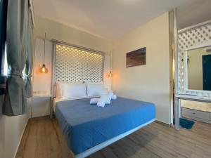 Postel nebo postele na pokoji v ubytování Michail Suites Afiartis Karpathos