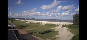 a view of a beach with a group of people at Friese Kust Villa in Workum