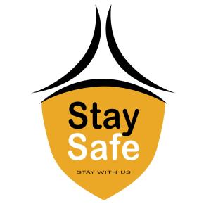a yellow shield with the words stay safe stay with us at T2 Jomtien Pattaya in Jomtien Beach