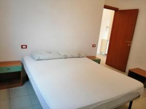 Ένα ή περισσότερα κρεβάτια σε δωμάτιο στο Appartamento indipendete VillaRosa