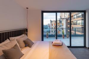 Ένα ή περισσότερα κρεβάτια σε δωμάτιο στο Stay Suites