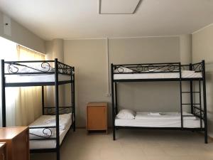 a room with two bunk beds in a room at ГотельОК Видубичі in Kyiv