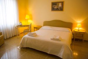 Posteľ alebo postele v izbe v ubytovaní Residence Ancona