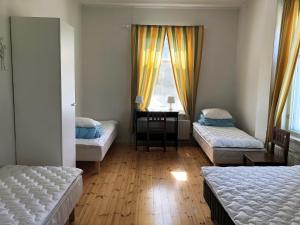 Säng eller sängar i ett rum på Wanha Karhunmäki
