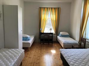 Ένα ή περισσότερα κρεβάτια σε δωμάτιο στο Wanha Karhunmäki