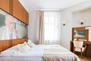 Posteľ alebo postele v izbe v ubytovaní Hotel Vabank