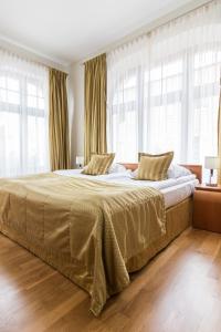 Posteľ alebo postele v izbe v ubytovaní Hotel Vabank