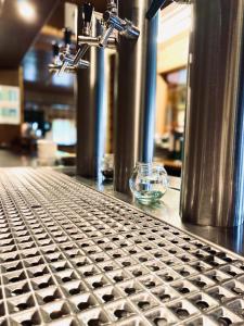 a glass bowl sitting on top of a metal counter at Hotel Auerhahn in Grevenkrug