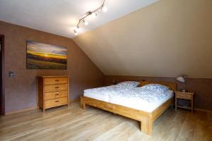 En eller flere senge i et værelse på Silence Ferienwohnungen mit - 2 Apartments