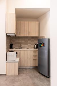 A kitchen or kitchenette at MARKOS LUXURY APARTMENTS