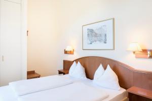 Postel nebo postele na pokoji v ubytování Hapimag Ferienwohnungen Bad Gastein