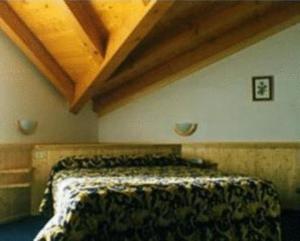 Postel nebo postele na pokoji v ubytování Albergo Gilda
