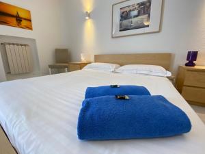 Un ou plusieurs lits dans un hébergement de l'établissement Villa Leucatia