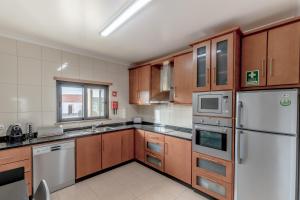 Kuchyň nebo kuchyňský kout v ubytování Apartamento 7 Mares