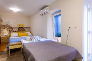 Postel nebo postele na pokoji v ubytování Room M