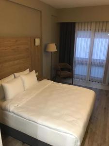 En eller flere senge i et værelse på NEHİR HOTEL KEŞAN