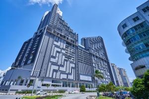 a large building in a city with tall buildings at Imperio Residences Melaka Malacca in Malacca