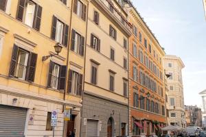 a group of buildings on a city street at BMGA l ViaPaola43 Palace in Rome