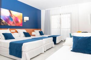 Postel nebo postele na pokoji v ubytování Hotel Jaime I