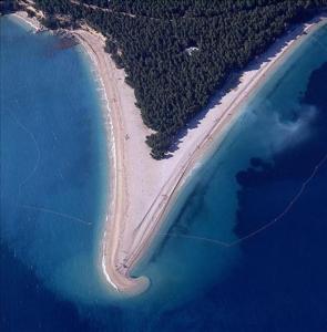 
an aerial view of a beach with a large body of water at Villa Dujmović Dvori in Bol
