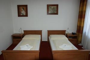 Posteľ alebo postele v izbe v ubytovaní Hotel Maria