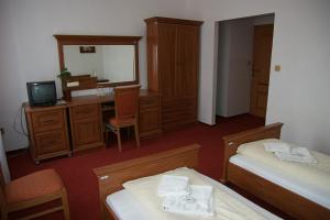 Posteľ alebo postele v izbe v ubytovaní Hotel Maria