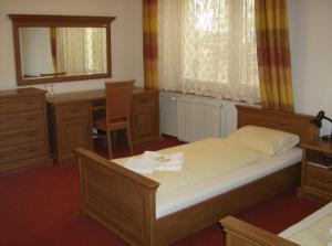 Posteľ alebo postele v izbe v ubytovaní Hotel Maria