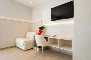 TV a/nebo společenská místnost v ubytování Hotel Corallo