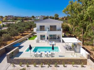 an aerial view of a villa with a swimming pool at Constantinos Villa, Sublime Island Εscape, By ThinkVilla in Panormos Rethymno