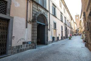 an alley in an old town with buildings at Green house in Orvieto