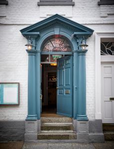 a blue entrance to a building with a blue door at Artist Residence Cornwall in Penzance