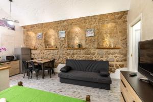a living room with a couch and a table at Green house in Orvieto