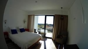 Un pat sau paturi într-o cameră la Vinha do Gaio