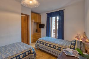 Ένα ή περισσότερα κρεβάτια σε δωμάτιο στο Albergo Moleta