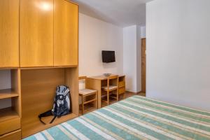 Ένα ή περισσότερα κρεβάτια σε δωμάτιο στο Albergo Moleta