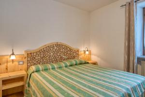 Ένα ή περισσότερα κρεβάτια σε δωμάτιο στο Albergo Moleta