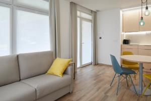 a living room with a couch and a table at Apartamentos Isaga in Zarautz