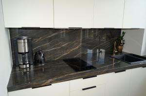 Kuchyňa alebo kuchynka v ubytovaní Apartament Pisz Centrum 7
