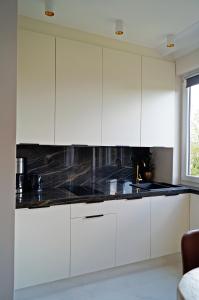 Kuchyňa alebo kuchynka v ubytovaní Apartament Pisz Centrum 7
