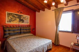 A bed or beds in a room at Casa Vacanze 4 Pileri