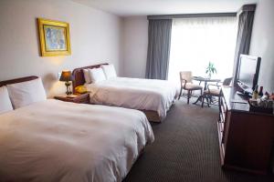 Postel nebo postele na pokoji v ubytování BTH Hotel Lima Golf