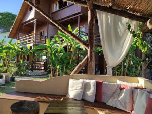 a couch sitting in front of a house at Guesthouse Vila Druri Dhermi in Dhërmi +35 photos