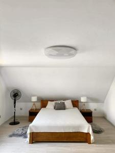 מיטה או מיטות בחדר ב-Colorado Podhale