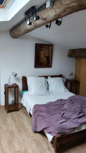 Cama ou camas em um quarto em Le loft d'Anne