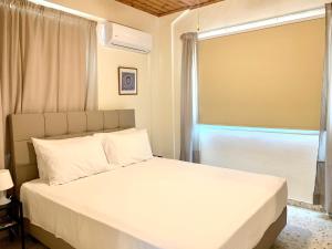 Кровать или кровати в номере Himonas Apartments