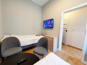 TV a/nebo společenská místnost v ubytování Apartament Kleopatra