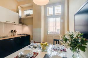 a kitchen with a table with a bowl of fruit on it at APT in center Prague w Netflix by Michal&Friends in Prague