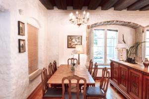 a dining room with a wooden table and chairs at Tallinn City Apartments Old Town 3 bedroom in Tallinn