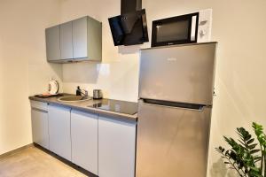 Kuchyň nebo kuchyňský kout v ubytování Apart-House Uniejów