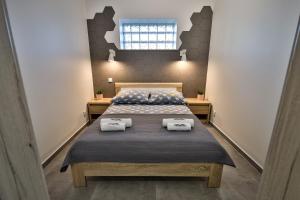 Postel nebo postele na pokoji v ubytování Apart-House Uniejów